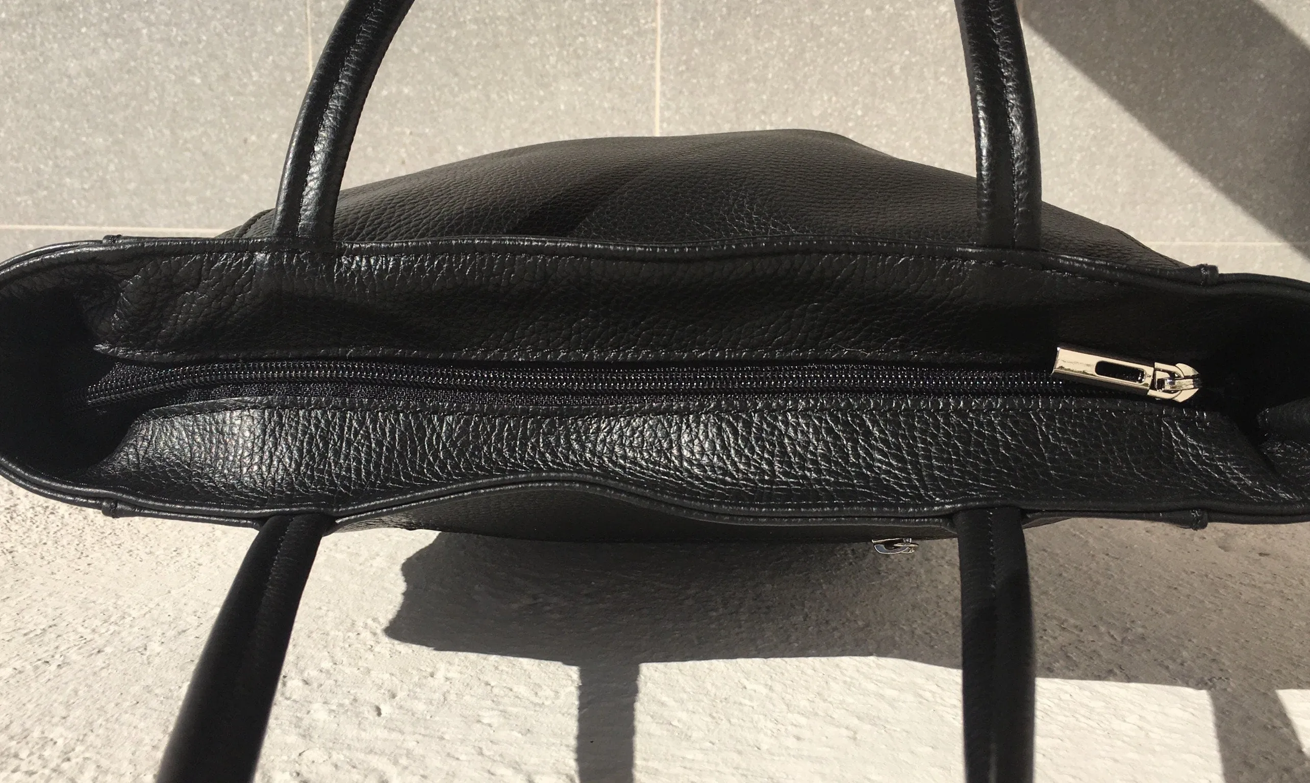 NEW with zipper and lining. Tote leather bag in BLACK . Soft GENUINE  leather bag. Large black bag .Laptop or book bag. Black  tote